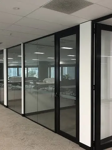Black-framed glass office partitions and doors installed by Elder Glass in a Brisbane commercial fit-out