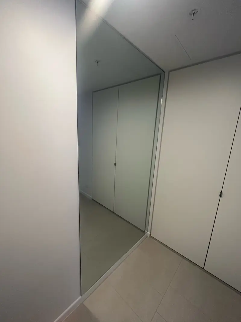 Fixed frameless walk-in shower panel