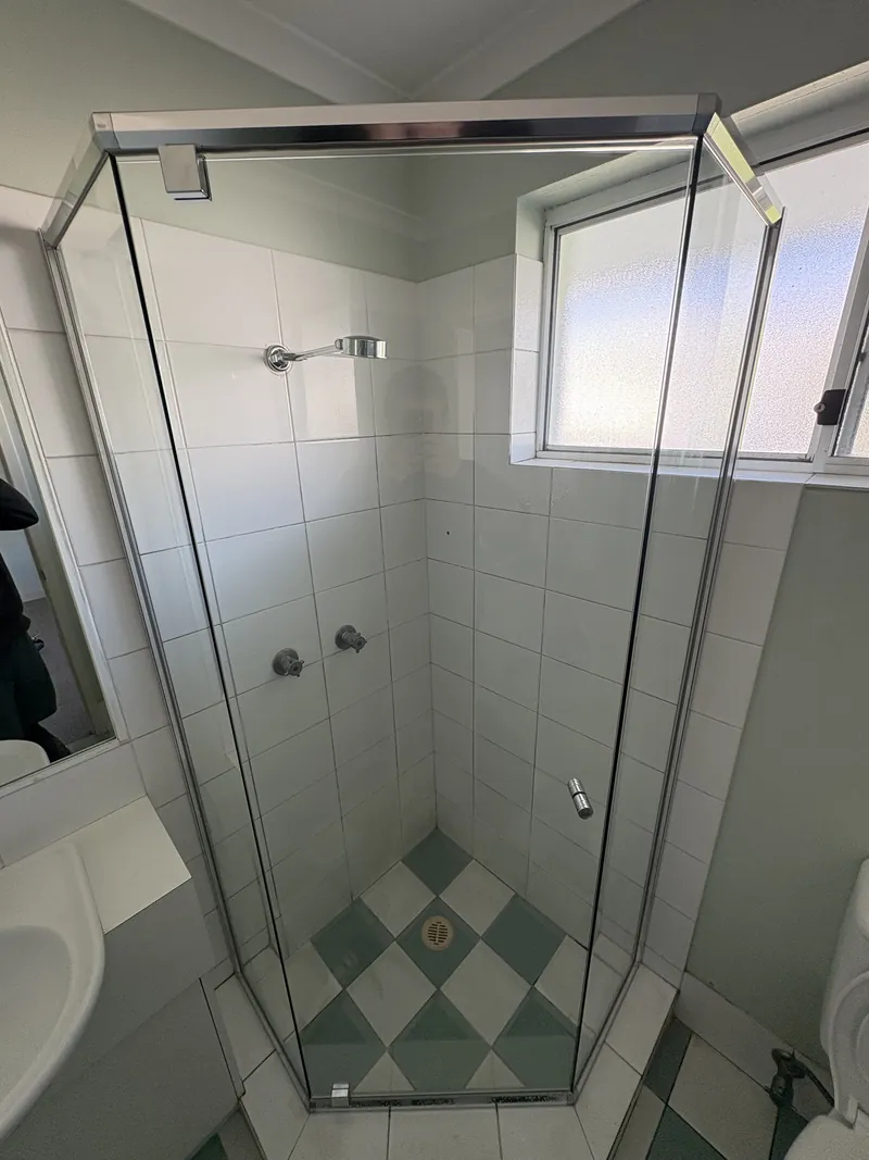 Semi-frameless angled diamond shower screen with chrome frame, Brisbane